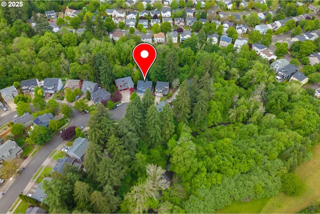 aerial view of property's location with nearby suburban area
