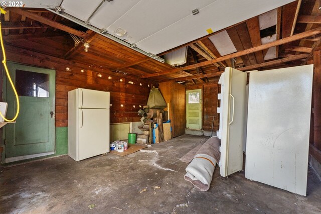 3148 Willamette St, Eugene, OR 97405 - garage with freestanding refrigerator and wooden walls