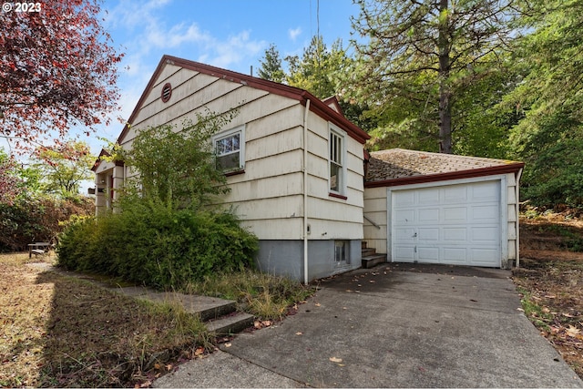 3148 Willamette St, Eugene, OR 97405 - view of side of home with concrete driveway and a detached garage