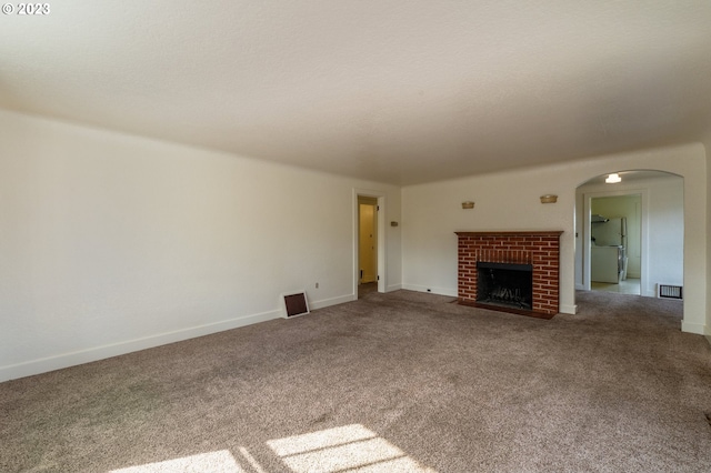 3148 Willamette St, Eugene, OR 97405 - unfurnished living room with arched walkways, carpet flooring, a fireplace, and baseboards