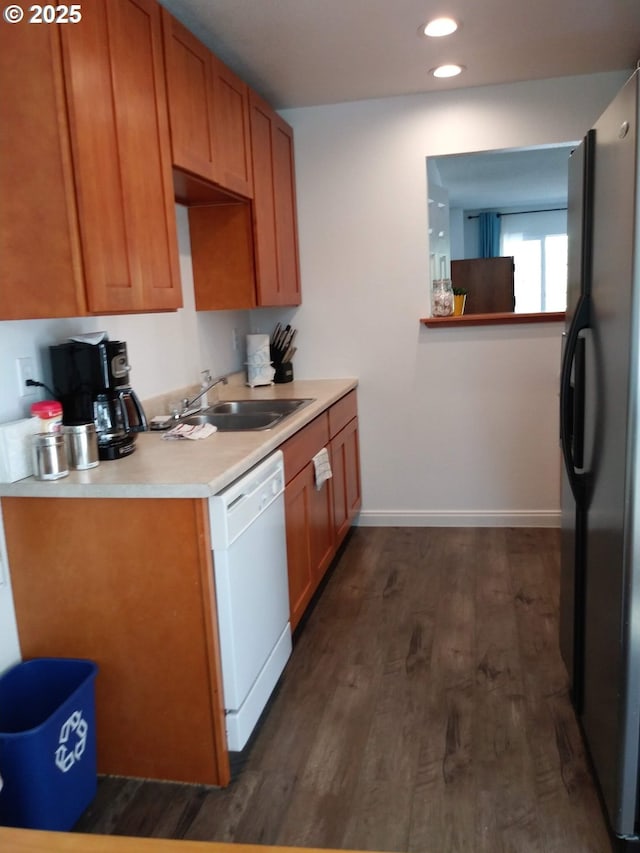 878 I St, Washougal, WA 98671 - kitchen with dishwasher, freestanding refrigerator, dark wood finished floors, light countertops, and brown cabinetry