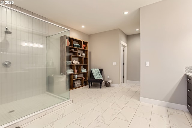 bathroom featuring vanity and a shower with shower door