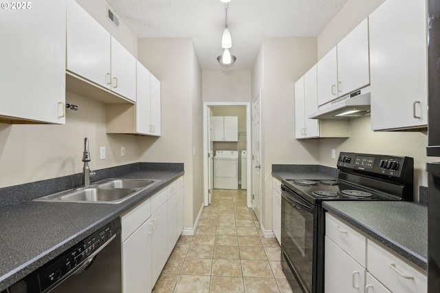 kitchen with under cabinet range hood, a sink, visible vents, black appliances, and washing machine and clothes dryer