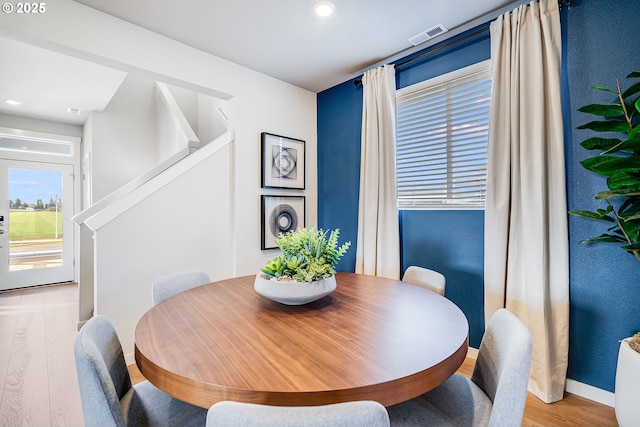883 Legacy St, Eugene, OR 97402 - dining room featuring stairs, light wood-style flooring, recessed lighting, and baseboards