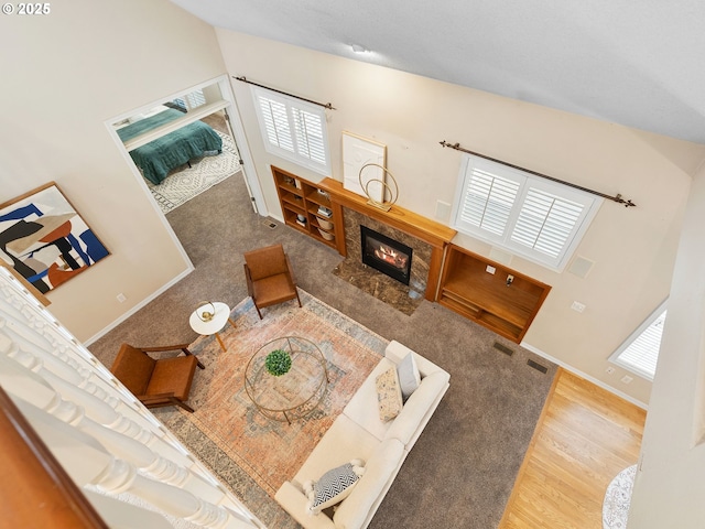 17712 SW 81st Pl, Durham, OR 97224 - living area featuring wood finished floors, a premium fireplace, baseboards, and high vaulted ceiling