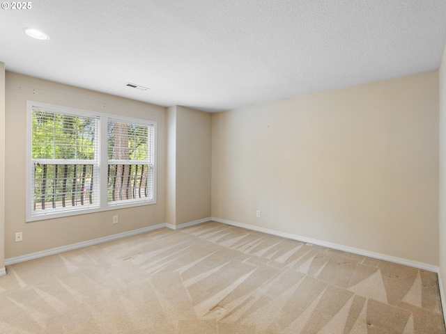 17712 SW 81st Pl, Durham, OR 97224 - spare room featuring light colored carpet, baseboards, a textured ceiling, and recessed lighting