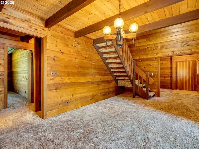 26619 NE 77th Ave, Battle Ground, WA 98604 - unfurnished living room featuring carpet floors, wood ceiling, a chandelier, and wooden walls