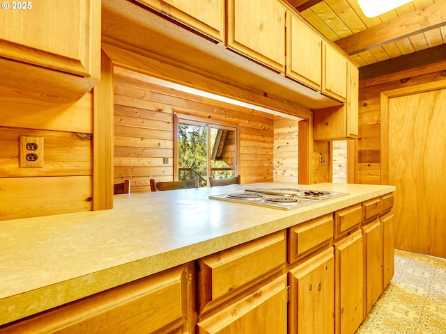 26619 NE 77th Ave, Battle Ground, WA 98604 - kitchen with wood ceiling, beam ceiling, light countertops, wooden walls, and stainless steel electric cooktop
