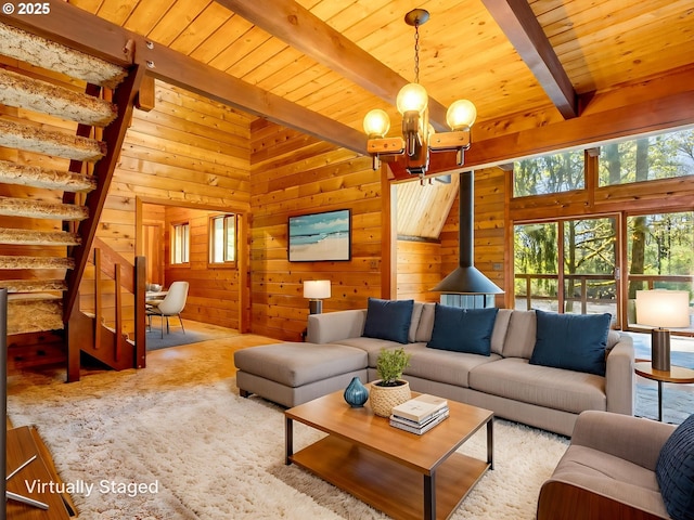 26619 NE 77th Ave, Battle Ground, WA 98604 - living area featuring wood ceiling, wood walls, beam ceiling, a notable chandelier, and stairs