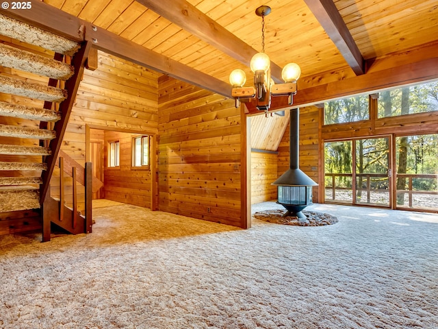 26619 NE 77th Ave, Battle Ground, WA 98604 - interior space with an inviting chandelier, a wood stove, carpet, and a healthy amount of sunlight
