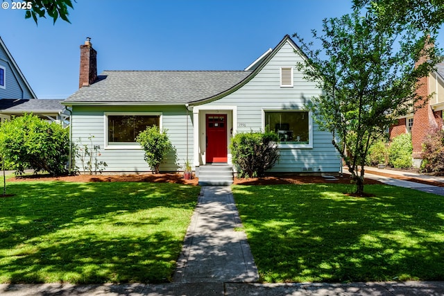 1556 Washington St, Eugene, OR 97401 - bungalow-style home featuring a front yard, a chimney, and a shingled roof