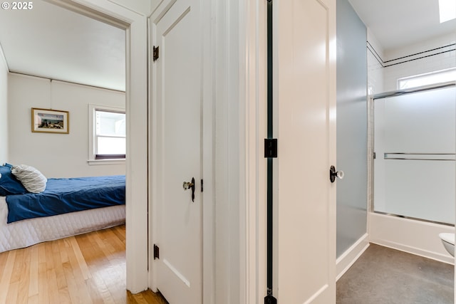 1556 Washington St, Eugene, OR 97401 - ensuite bathroom featuring toilet, hardwood / wood-style floors, and bath / shower combo with glass door