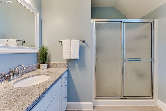1556 Washington St, Eugene, OR 97401 - full bath featuring vanity, a shower stall, baseboards, and vaulted ceiling