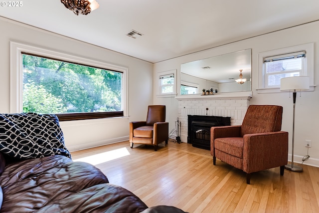 1556 Washington St, Eugene, OR 97401 - living room featuring light wood-style floors, a fireplace, and baseboards