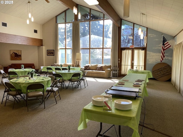 interior space featuring ceiling fan, beam ceiling, and high vaulted ceiling