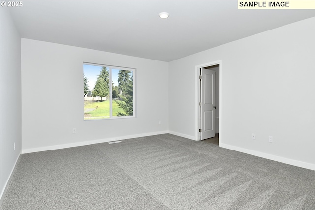 5329 NE 68th St, Vancouver, WA 98661 - spare room featuring visible vents, baseboards, and dark carpet