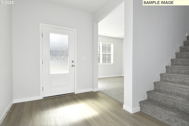 5329 NE 68th St, Vancouver, WA 98661 - foyer entrance featuring baseboards, wood finished floors, and stairs