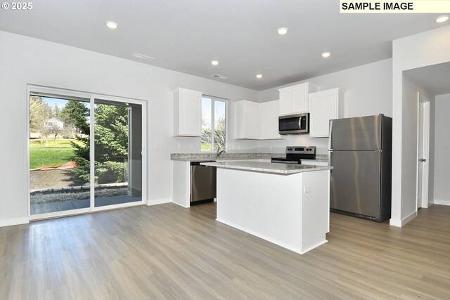 5329 NE 68th St, Vancouver, WA 98661 - kitchen featuring light wood finished floors, a kitchen island, recessed lighting, and stainless steel appliances