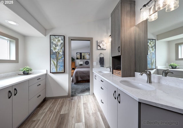 9312 NE 30th Ave, Vancouver, WA 98665 - full bathroom with double vanity, ensuite bath, wood finished floors, and recessed lighting