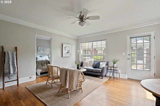 2643 NW Raleigh St Unit 30, Portland, OR 97210 - living area with ornamental molding, ceiling fan, wood finished floors, and baseboards