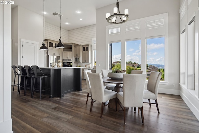 5360 NW 18th Ave, Camas, WA 98607 - dining space featuring a towering ceiling, a chandelier, dark wood finished floors, recessed lighting, and baseboards