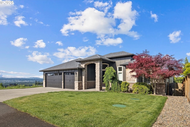 5360 NW 18th Ave, Camas, WA 98607 - prairie-style house with brick siding, driveway, an attached garage, roof with shingles, and board and batten siding