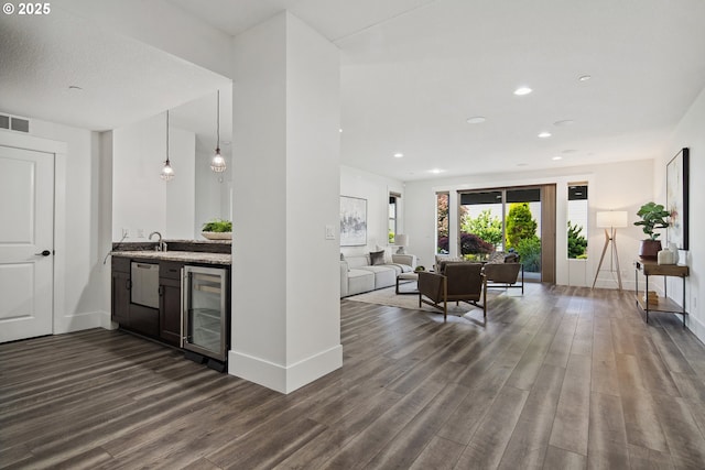 5360 NW 18th Ave, Camas, WA 98607 - kitchen with beverage cooler, dark wood finished floors, baseboards, and recessed lighting