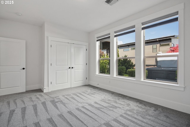 5360 NW 18th Ave, Camas, WA 98607 - unfurnished bedroom featuring multiple windows, carpet flooring, baseboards, and a closet