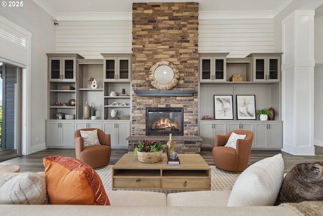 5360 NW 18th Ave, Camas, WA 98607 - living room featuring ornamental molding, wood finished floors, a large fireplace, baseboards, and a high ceiling