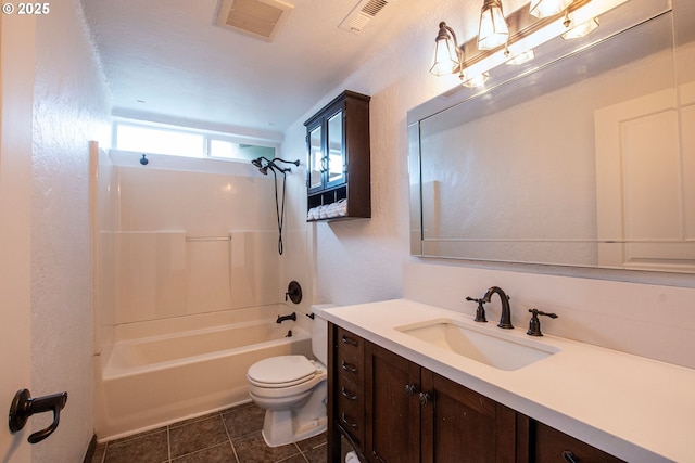 full bathroom with visible vents, toilet, washtub / shower combination, vanity, and tile patterned floors