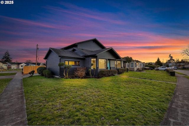 view of front of home featuring a lawn