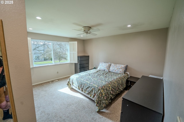 carpeted bedroom featuring visible vents, recessed lighting, a ceiling fan, and baseboards