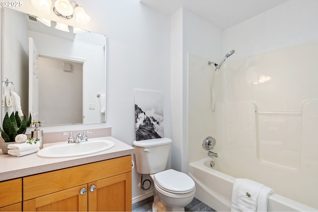 full bath with toilet, vanity, and tub / shower combination