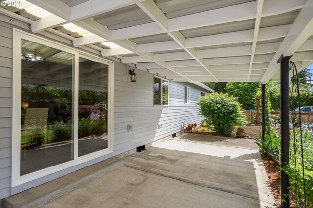 view of patio featuring fence