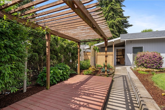 wooden deck with a pergola and fence