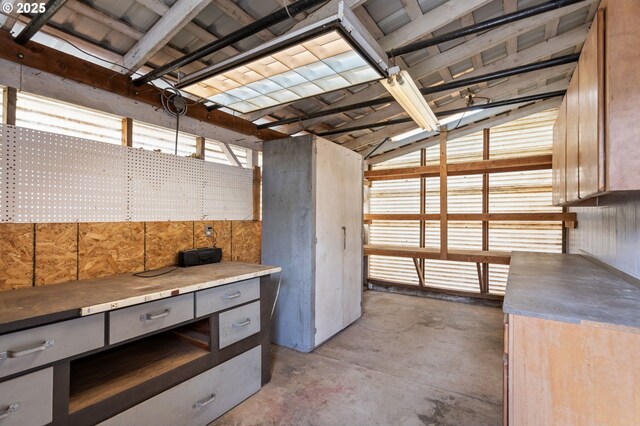 misc room with unfinished concrete flooring