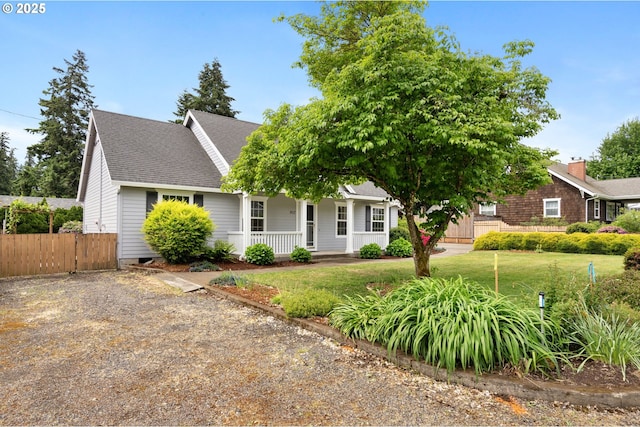 view of front of house with a porch and a shingled roof