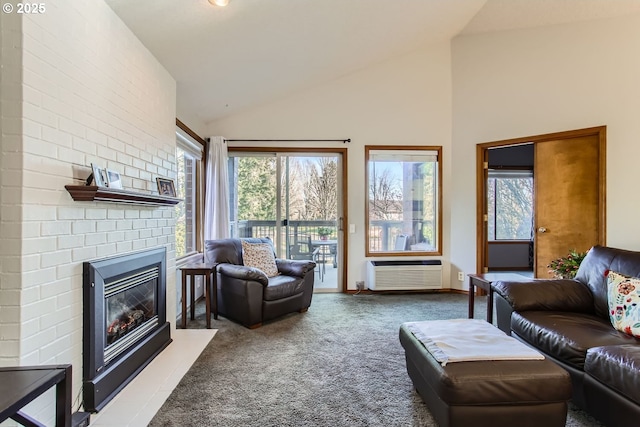 carpeted living room with a wall mounted air conditioner and high vaulted ceiling