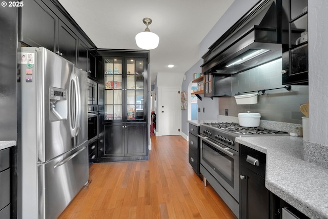 683 Laurel, Junction City, OR 97448 - kitchen with stainless steel appliances, dark cabinetry, light countertops, light wood finished floors, and recessed lighting