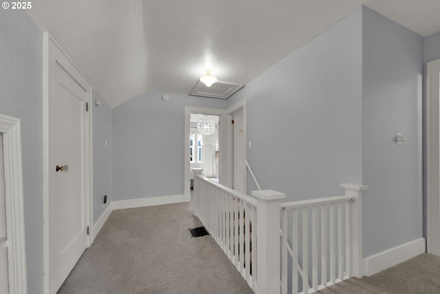 683 Laurel, Junction City, OR 97448 - corridor with an upstairs landing, carpet, vaulted ceiling, a textured ceiling, and baseboards