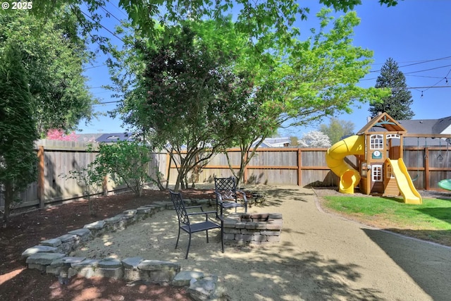 683 Laurel, Junction City, OR 97448 - fenced backyard featuring a playground and a patio area