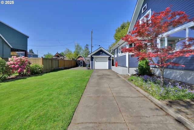 683 Laurel, Junction City, OR 97448 - view of yard with an outbuilding, driveway, and a garage