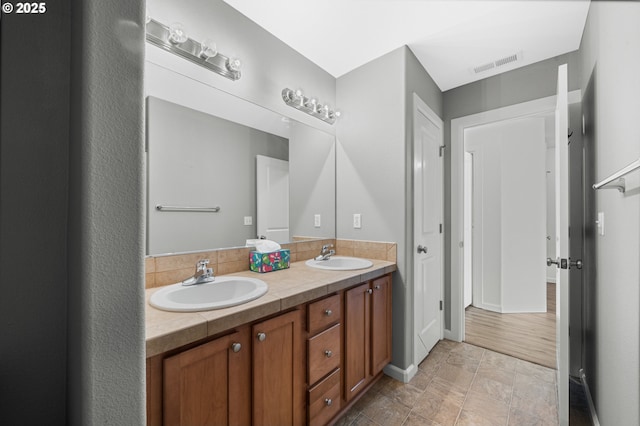 12115 NE 40th Cir, Vancouver, WA 98682 - full bathroom featuring baseboards, a sink, visible vents, and double vanity