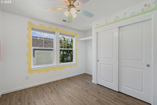 12115 NE 40th Cir, Vancouver, WA 98682 - unfurnished bedroom with wood finished floors, a closet, baseboards, and visible vents