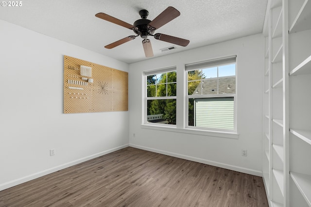 12115 NE 40th Cir, Vancouver, WA 98682 - unfurnished room featuring visible vents, baseboards, a ceiling fan, and wood finished floors