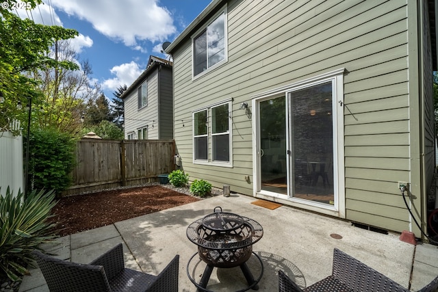12115 NE 40th Cir, Vancouver, WA 98682 - back of house with a fire pit, a fenced backyard, and a patio