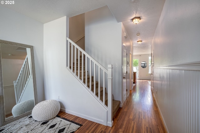 12115 NE 40th Cir, Vancouver, WA 98682 - stairs featuring baseboards, wood finished floors, and a textured ceiling