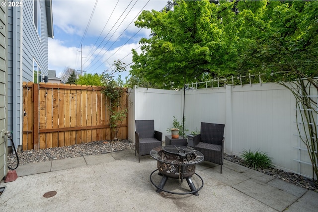 12115 NE 40th Cir, Vancouver, WA 98682 - view of patio / terrace with a fire pit and a fenced backyard