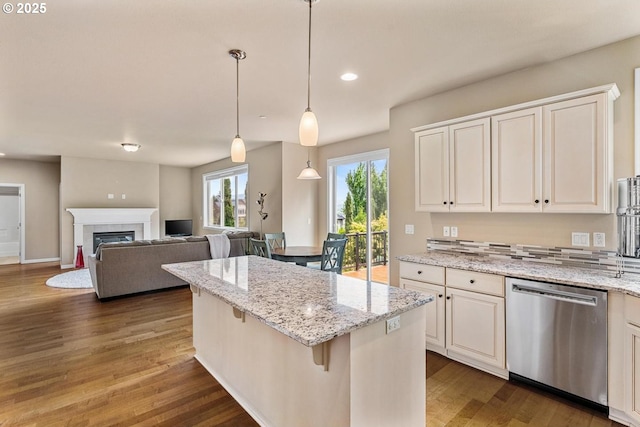 2814 NW Hill St, Camas, WA 98607 - kitchen featuring dishwasher, a center island, a fireplace, wood finished floors, and recessed lighting