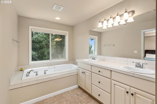 2814 NW Hill St, Camas, WA 98607 - ensuite bathroom with healthy amount of natural light, double vanity, a bath, and recessed lighting